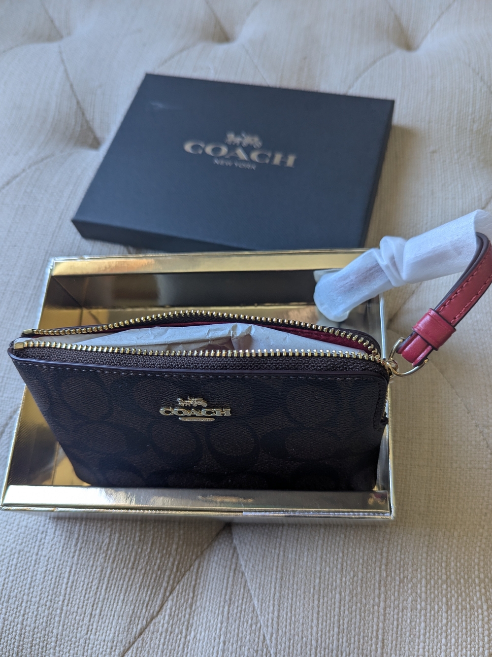 COACH Brown Signature Zip Wristlet with Red Accent